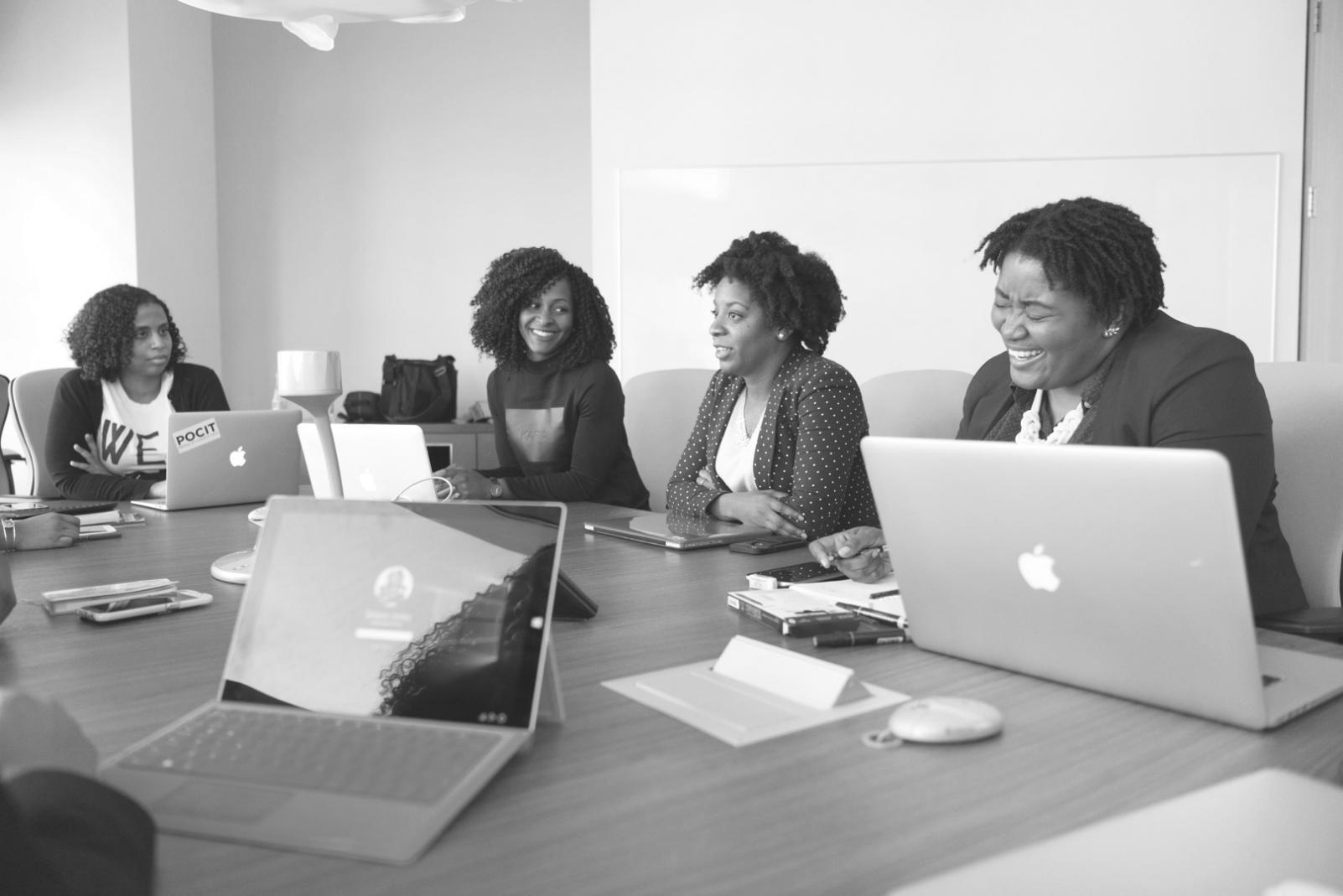 Workshop participants studying algorithmic trading strategies